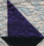 A single sailing boat block from Spinning Sailboats by Anne Gallo and Susan Raban exhibited at the Vermont Quilt Festival 2012